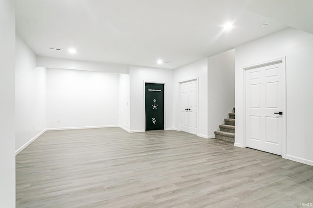 unfurnished living room with light hardwood / wood-style floors