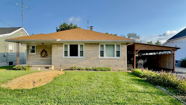 view of front facade with a carport, a front yard, stone siding, and roof with shingles