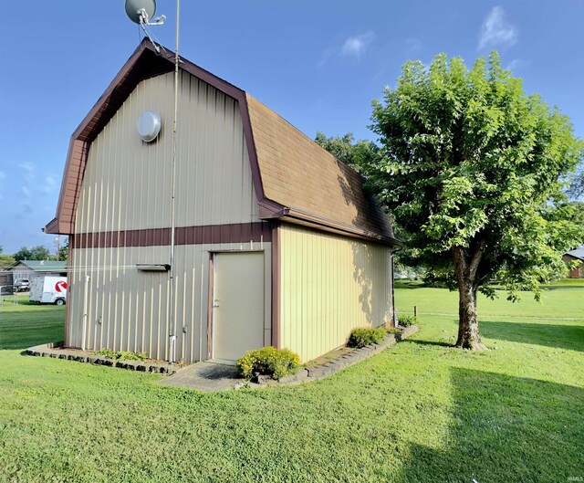 view of outbuilding with a yard