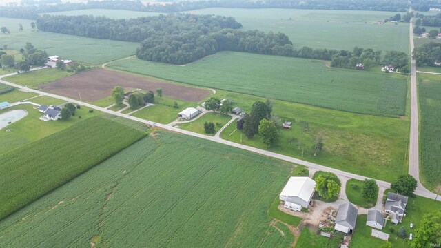 birds eye view of property featuring a rural view