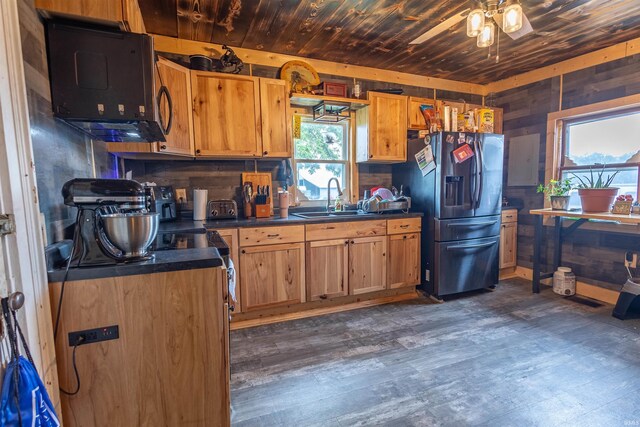 kitchen with dark hardwood / wood-style flooring, refrigerator with ice dispenser, ceiling fan, and wood ceiling