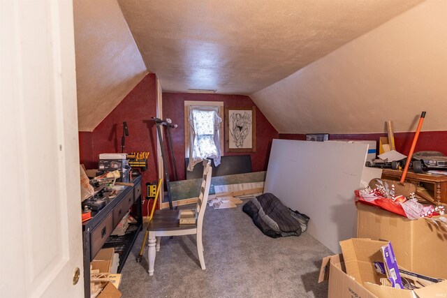 office area with lofted ceiling and carpet flooring