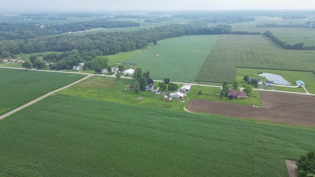 birds eye view of property with a rural view