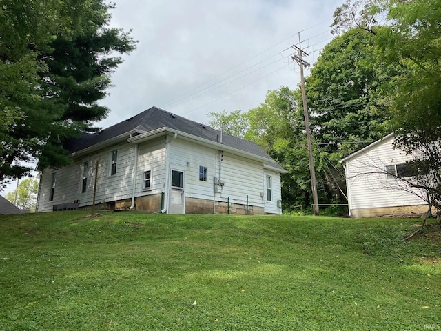 435 16th St, Bedford, IN 47421 - rear view of house with a shingled roof and a yard