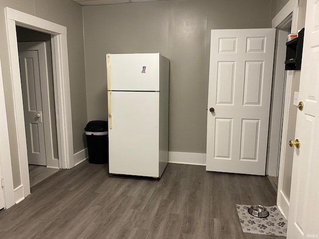 435 16th St, Bedford, IN 47421 - kitchen with baseboards, dark wood-style flooring, and freestanding refrigerator