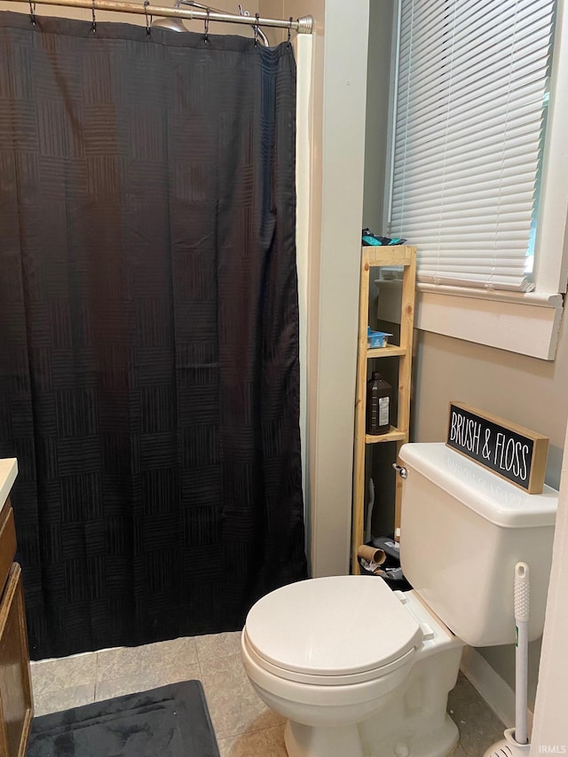 435 16th St, Bedford, IN 47421 - full bath featuring a shower with curtain, toilet, and tile patterned flooring
