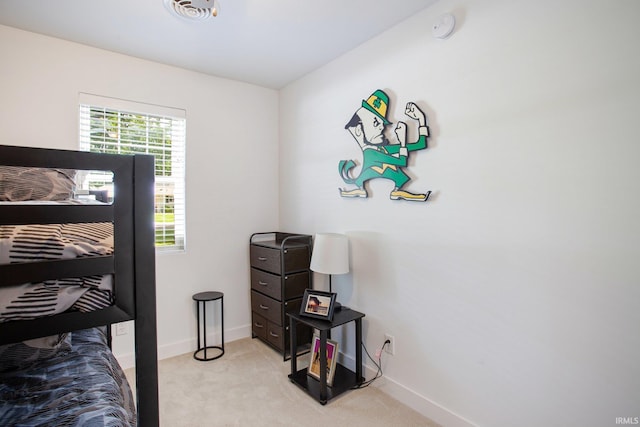 bedroom with light colored carpet