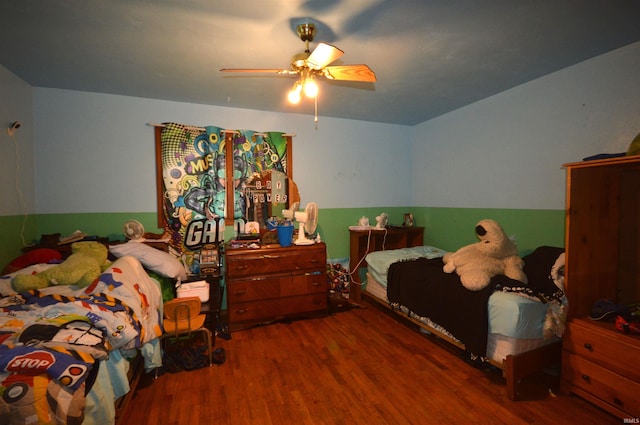 bedroom featuring ceiling fan and hardwood / wood-style floors