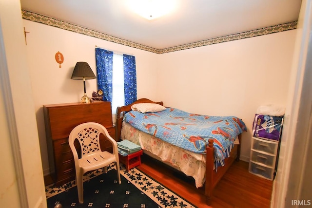 bedroom featuring hardwood / wood-style floors