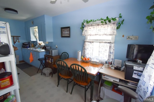 dining room with sink, carpet, and a wealth of natural light