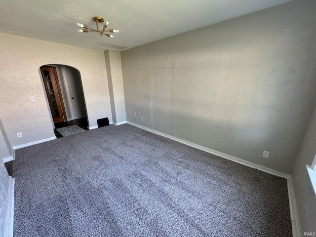 interior space featuring a notable chandelier and carpet