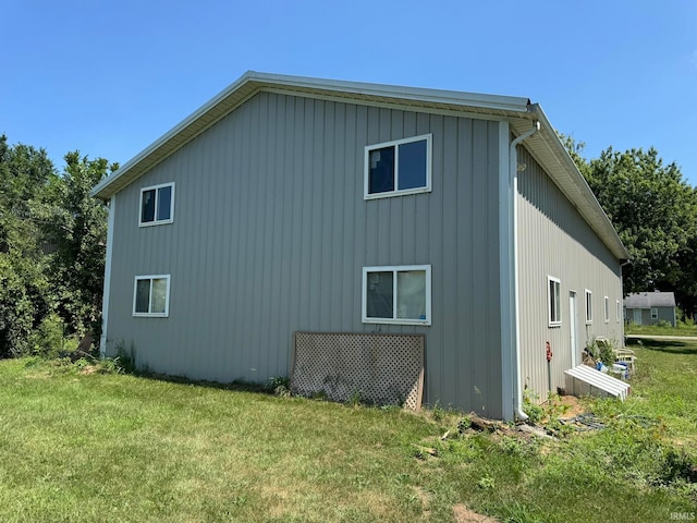 view of property exterior with a lawn