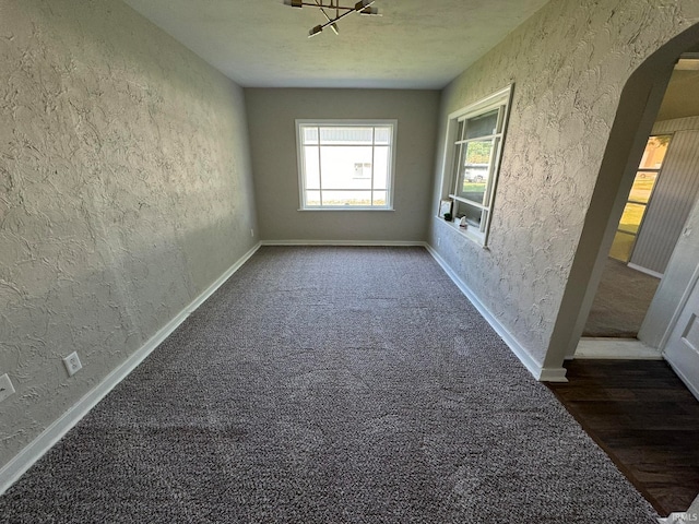 interior space featuring dark carpet