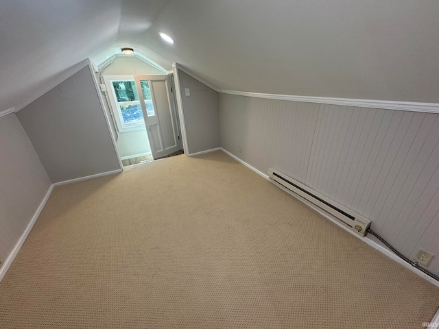 additional living space with carpet floors, lofted ceiling, and baseboard heating