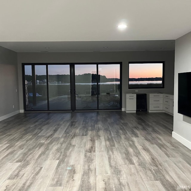 unfurnished living room with light hardwood / wood-style floors