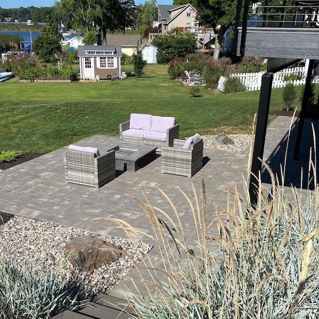 view of patio / terrace with a shed and outdoor lounge area