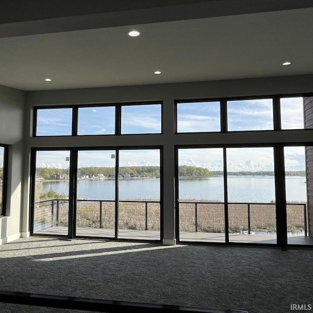 135 Ln 850 Snow Lk, Fremont, IN 46737 - entryway with a water view, recessed lighting, carpet flooring, and baseboards