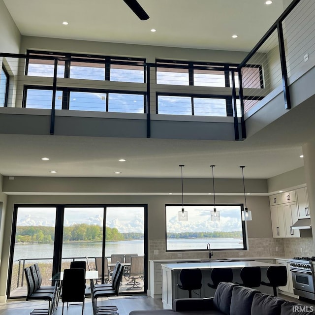 135 Ln 850 Snow Lk, Fremont, IN 46737 - living area with a water view, a high ceiling, and recessed lighting