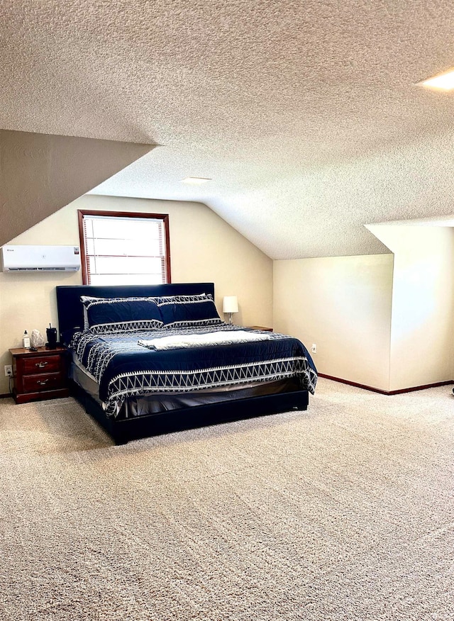 carpeted bedroom with an AC wall unit, a textured ceiling, and lofted ceiling