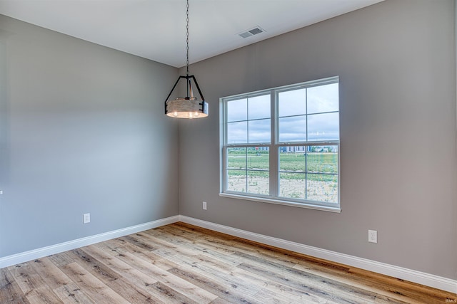 empty room with light hardwood / wood-style floors