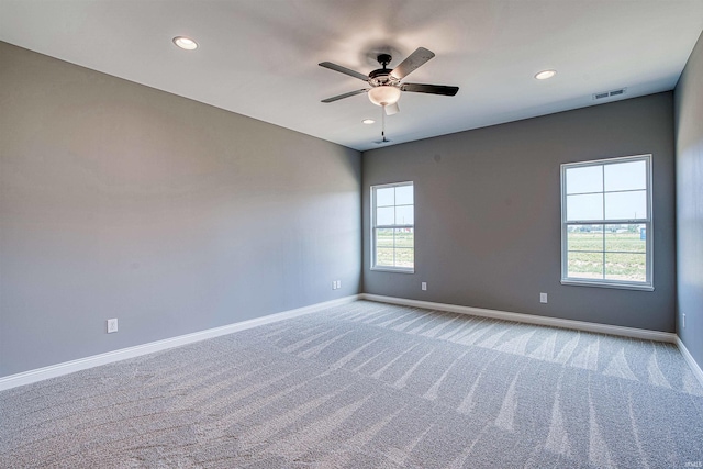 carpeted empty room with ceiling fan