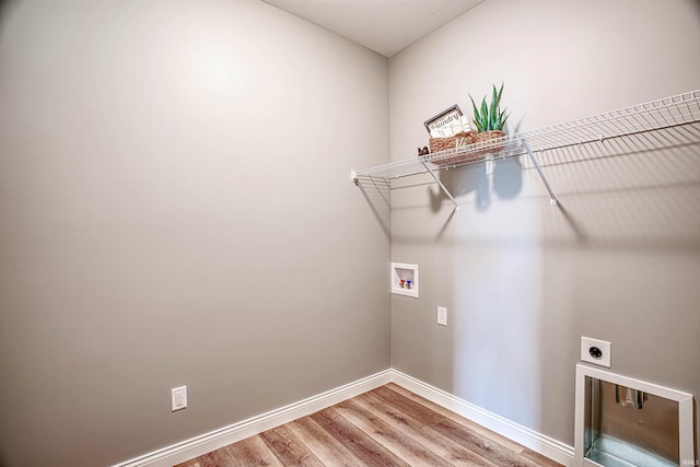 laundry room with washer hookup, hookup for an electric dryer, and hardwood / wood-style floors