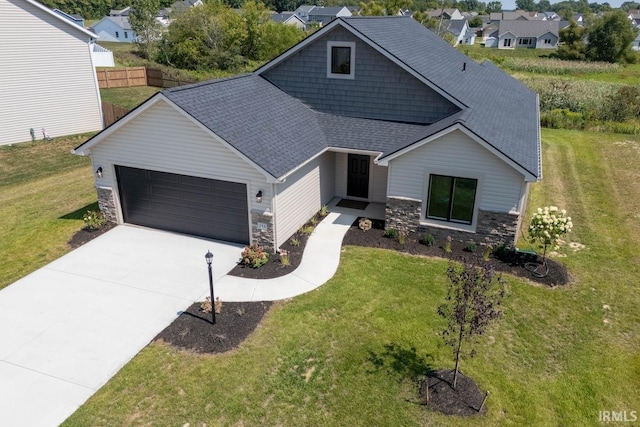 view of front of house with a front lawn and a garage