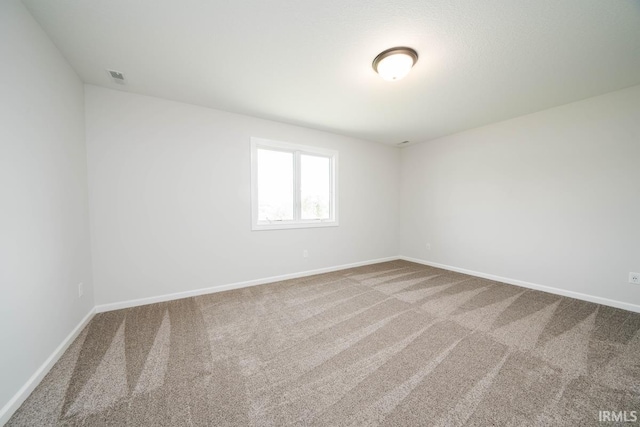 unfurnished room featuring carpet floors