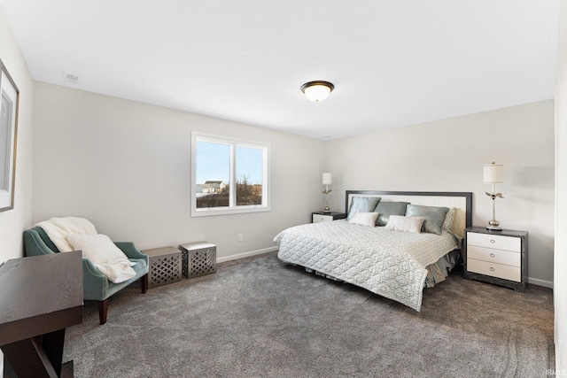 bedroom featuring dark colored carpet