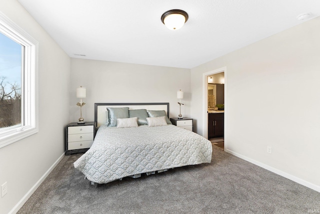 carpeted bedroom with ensuite bathroom