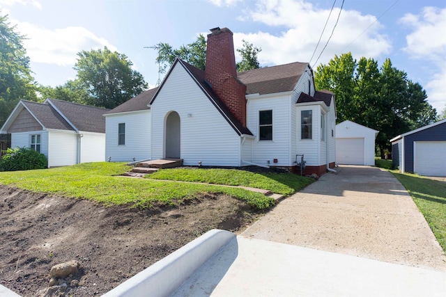 view of front of home with an outdoor structure and a garage