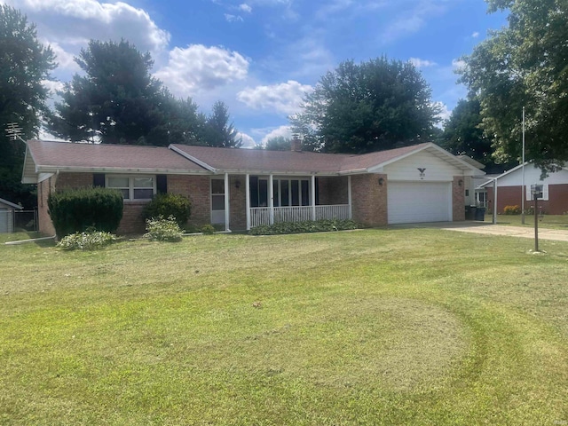 ranch-style home with a front yard and a garage