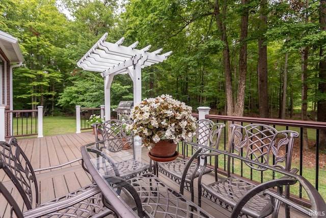 wooden deck with a pergola and grilling area