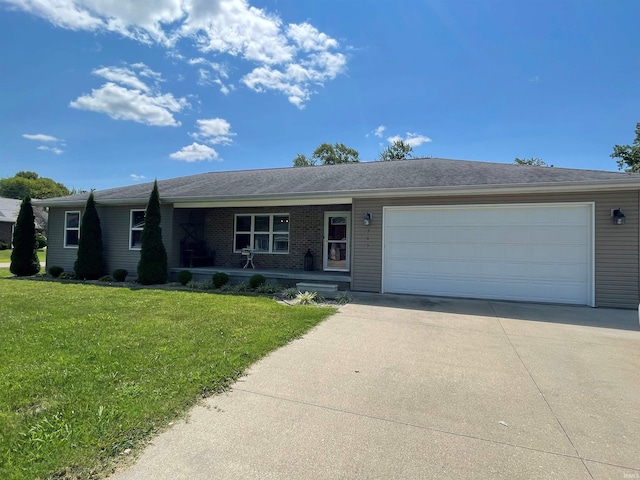 single story home featuring a garage and a front yard