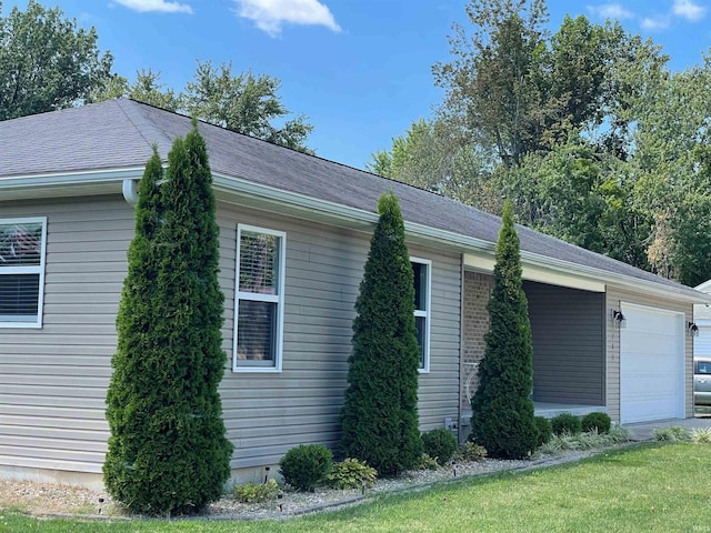 view of home's exterior with a yard