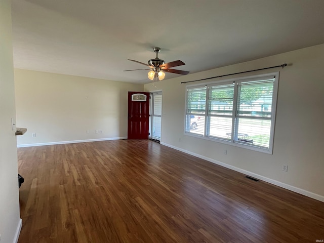 unfurnished living room featuring ceiling fan and hardwood / wood-style flooring