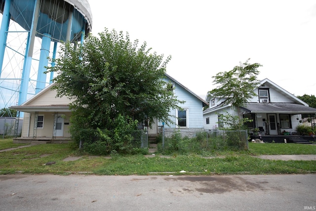 obstructed view of property featuring covered porch