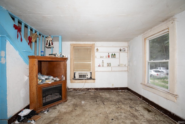 living room featuring concrete floors and cooling unit