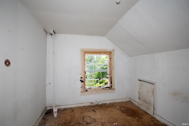 additional living space featuring vaulted ceiling