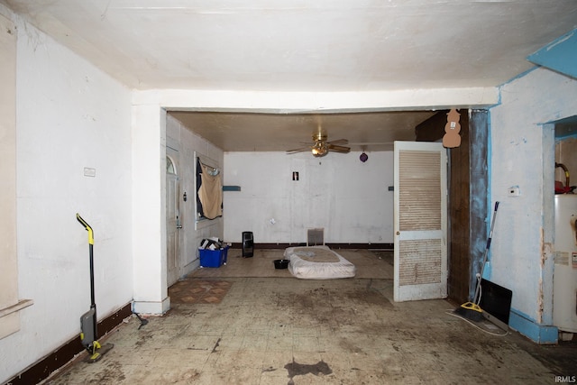 interior space featuring ceiling fan and gas water heater