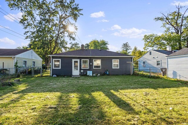 back of house with a yard