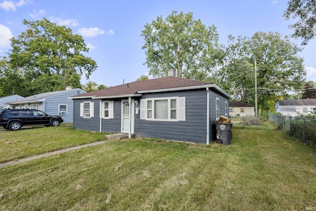 ranch-style house with a front yard