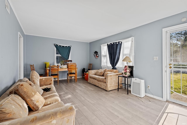 living room featuring light hardwood / wood-style flooring and plenty of natural light