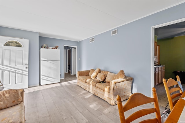 living room with light hardwood / wood-style floors