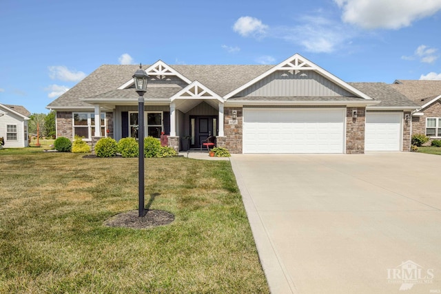 craftsman house with a front yard and a garage