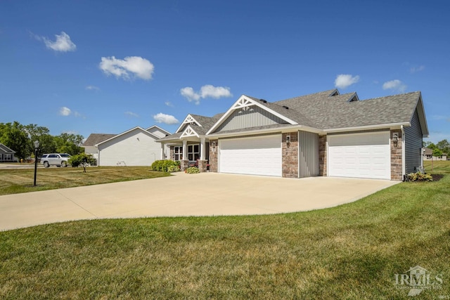 view of front of property with a front yard and a garage