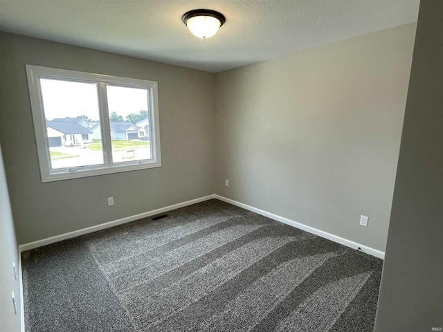 spare room with carpet floors