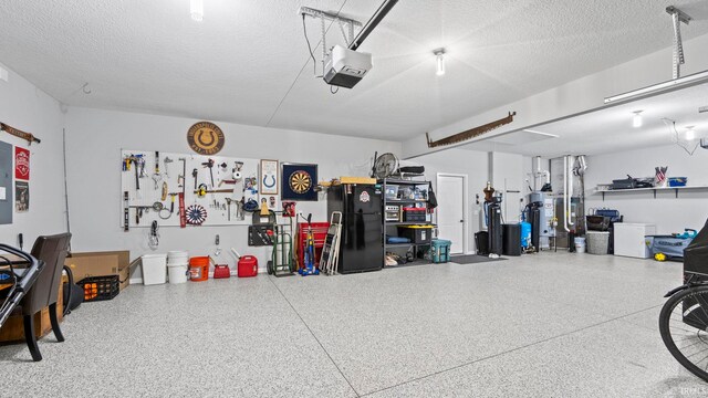 garage with gas water heater, a workshop area, and a garage door opener