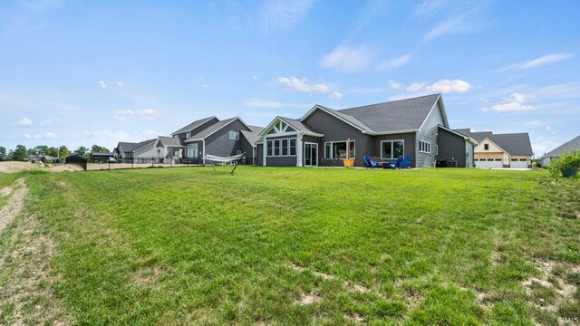 view of front of property with a garage and a front lawn