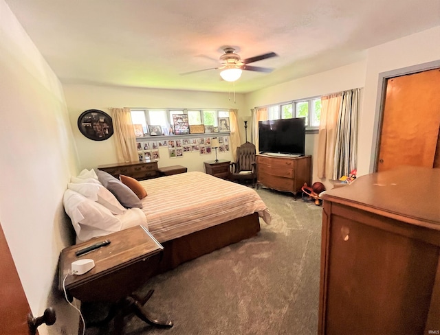 bedroom featuring ceiling fan and light colored carpet